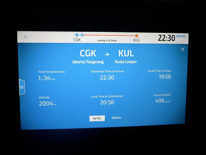 In-flight entertainment seat-back screen showing a flight information page aboard a Boeing 787-9